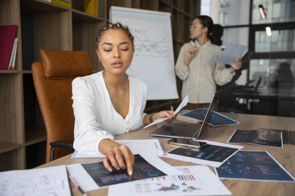 Office Workers Using Finance Graphs - RW Office