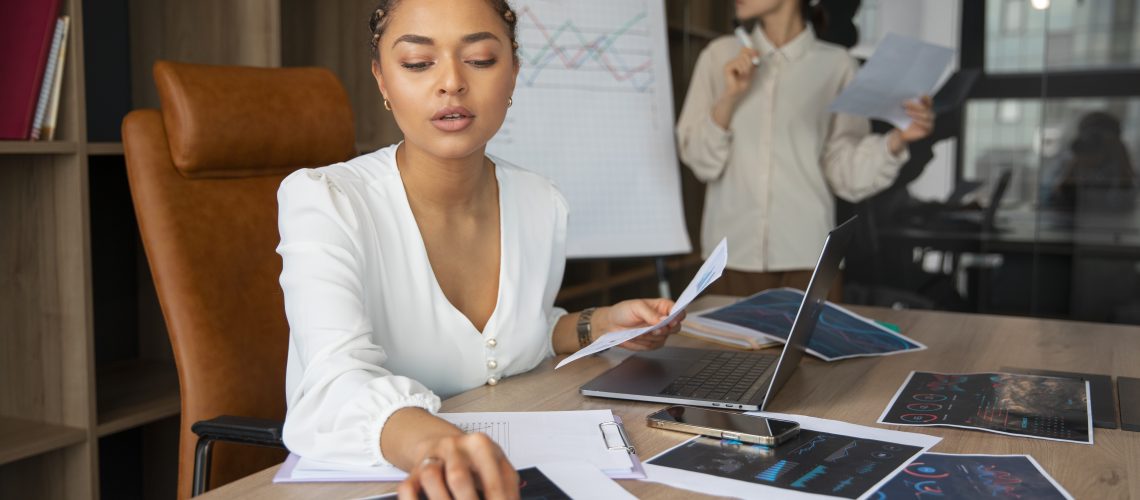 Office Workers Using Finance Graphs - RW Office